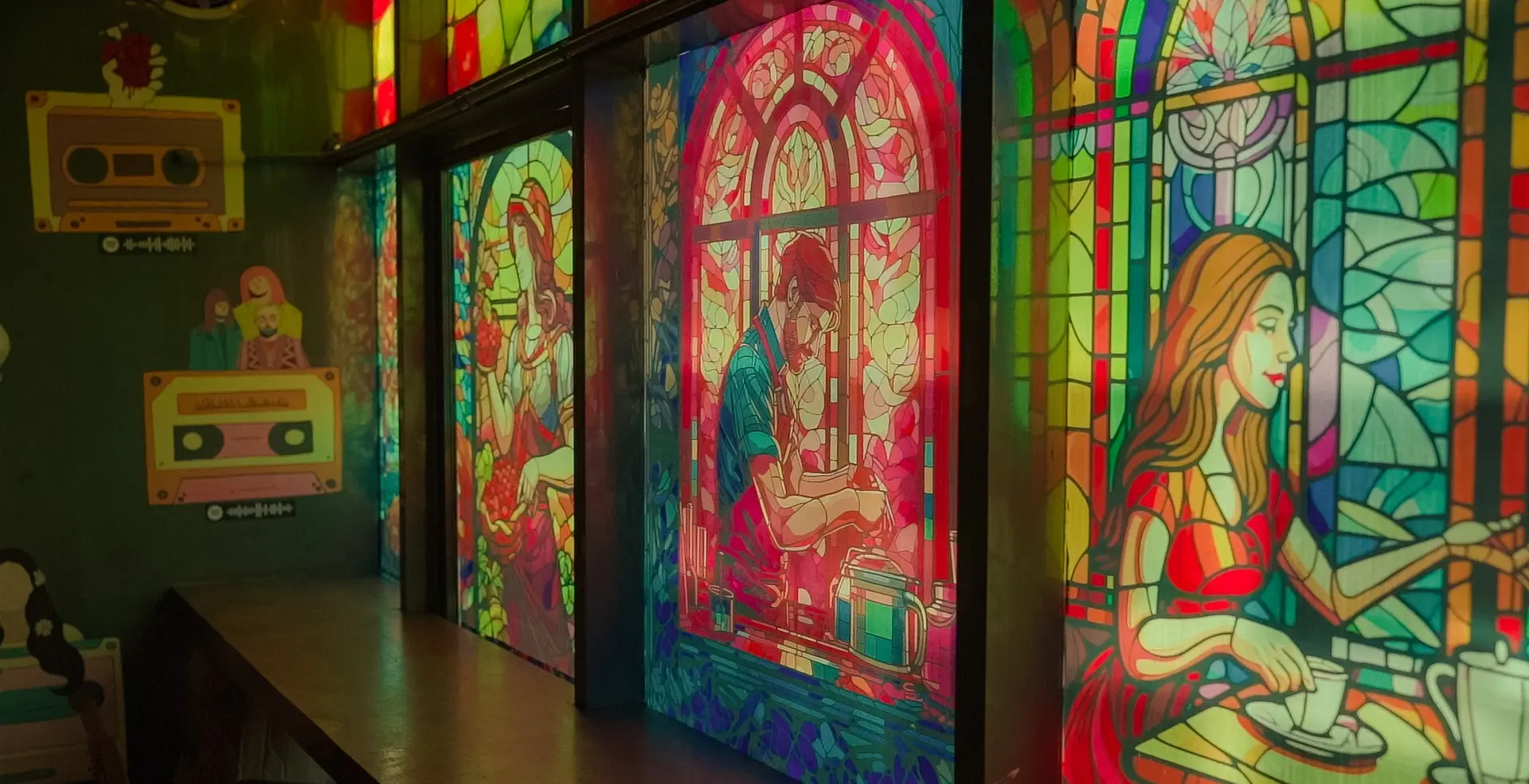 Colourful illustrated window panels beside Cafelytics seating