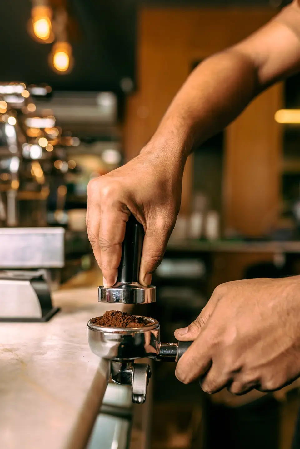 Cafelytics barista preparing espresso at the coffee counter